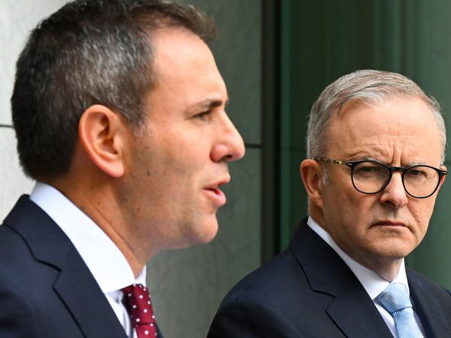 Australian Prime Minister Anthony Albanese listens to Australian Treasurer Jim Chalmers speak to the media during a press conference tat Parliament House in Canberra, Tuesday, February 28, 2023. (AAP Image/Lukas Coch) NO ARCHIVING