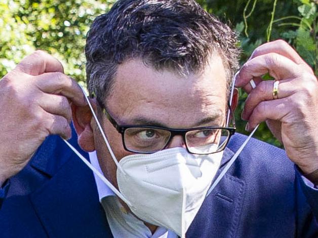 MELBOURNE, AUSTRALIA - NewsWire Photos February 17, 2022: (L-R) Victorian Premier Daniel Andrews puts on a mask after a press conference at Parliament. Picture: NCA NewsWire / Aaron Francis