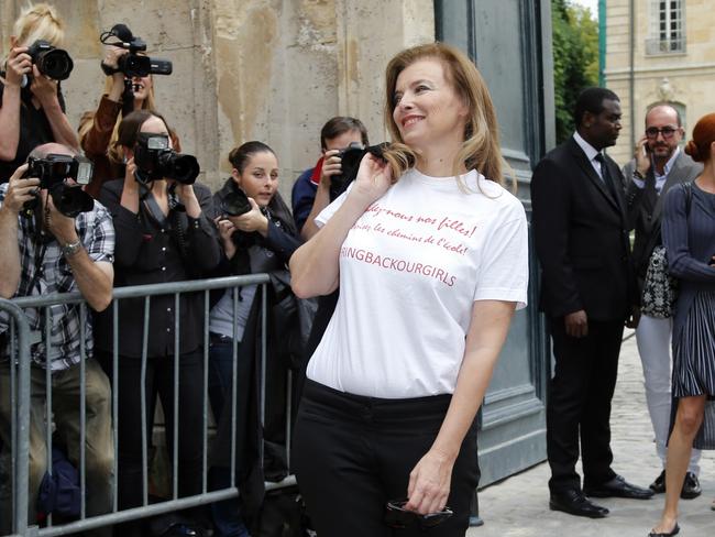 Sending a message ... Valerie Trierweiler, former companion of French President Francois Hollande, wearing a shirt reading "Bring back our girls" poses for photographers before Dior's show.