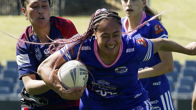 Narellan's Hope Schuster with the ball. Picture: John Appleyard