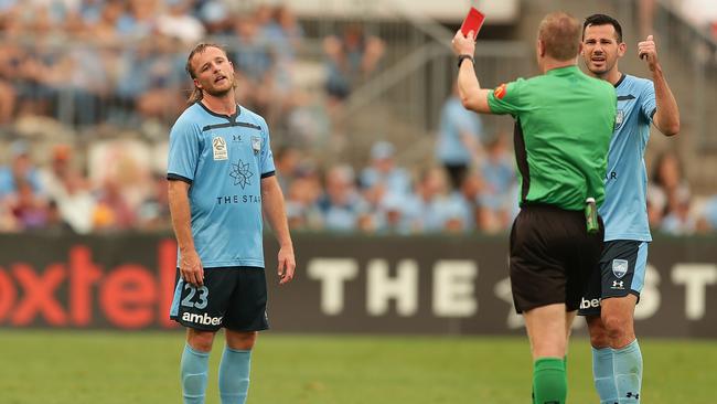 Sydney FC’s Rhyan Grant, left, reacts to the red card shown by referee Kurt Ams during last week’s match against Melbourne City at Jubilee Stadium. Picture: Getty Images
