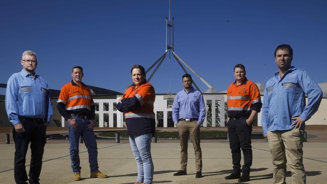 Refinery workers pose for a portrait at Parliament House in Canberra before meeting with federal politicians to discuss the future of Australia’s oil refineries. Left to right: Mick Denton, Dan Littlewood, Kristy Chambers, March Gough, Scott Grimes and Norm Page. Picture by Sean Davey.