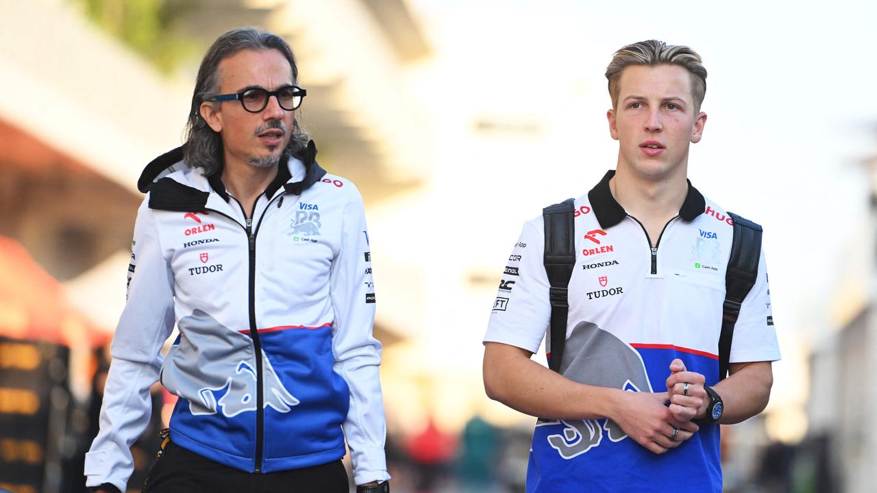 Liam Lawson (R) of New Zealand and Visa Cash App RB and Laurent Mekies, Team Principal of Visa Cash App RB walk in the Paddock. Rudy Carezzevoli/Getty Images/AFP