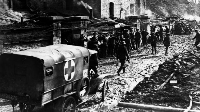 Australian soldiers walk past a Red Cross truck on the Western Front in Passchendaele during World War I in 1917. Picture: Australian War Memorial