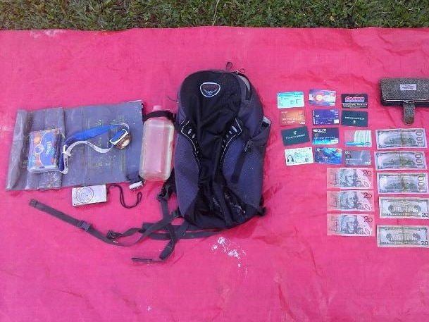 Hope Vale residents Philip and Reshmi Morris found a washed-up backpack at Cape Flattery beach, which belonged to American woman Emily Sheets – one of the survivors of a helicopter crash in the Whitsundays. Picture: Phillip Morris