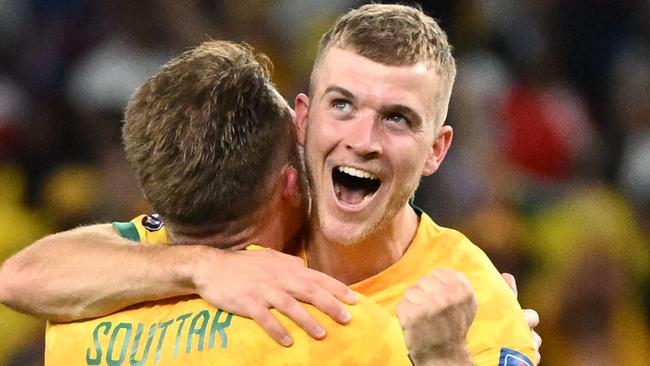 CORRECTION / Australia's defender #19 Harry Souttar (L) and Australia's midfielder #14 Riley McGree celebrate after they won the Qatar 2022 World Cup Group D football match between Australia and Denmark at the Al-Janoub Stadium in Al-Wakrah, south of Doha on November 30, 2022. (Photo by NATALIA KOLESNIKOVA / AFP) / âThe erroneous mention appearing in the metadata of this photo by NATALIA KOLESNIKOVA    has been modified in AFP systems in the following manner: Australia's midfielder #14 Riley McGree instead of Australia's forward #15 Mitchell Duke. Please immediately remove the erroneous mention[s] from all your online services and delete it from your servers. If you have been authorized by AFP to distribute it  to third parties, please ensure that the same actions are carried out by them. Failure to promptly comply with these instructions will entail liability on your part for any continued or post notification usage. Therefore we thank you very much for all your attention and prompt action. We are sorry for the inconvenience this notification may cause and remain at your disposal for any further information you may require.â