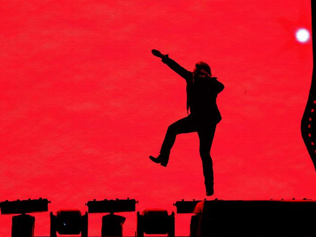 Bono leaps at the SCG. Picture: Getty