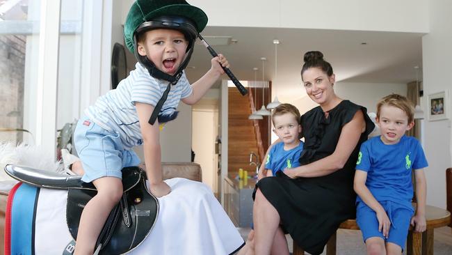 Cathy McEvoy with children Charlie, 7, Jake, 6 and Rhys, 3 at their Sydney home. Picture: Adam Taylor