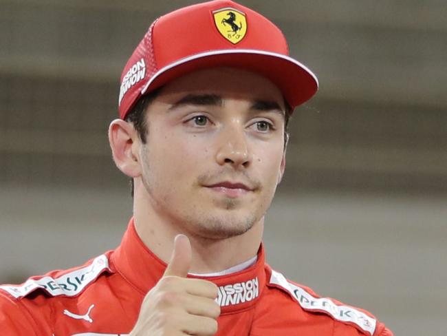 Ferrari's Monegasque driver Charles Leclerc celebrates after taking his first ever pole position during the qualifying session ahead of the Formula One Bahrain Grand Prix at the Sakhir circuit in the desert south of the Bahraini capital Manama, on March 30, 2019. - The Formula One Bahrain Grand Prix will be held on March 31. (Photo by KARIM SAHIB / AFP)