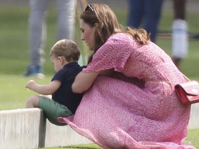 Britain's Kate, Duchess of Cambridge and Prince Louis attend the Royal Charity Polo Day at Billingbear Polo Club. Picture: AP