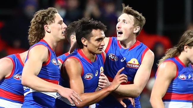 Jamarra Ugle-Hagan is surrounded by his teammates after kicking one of three goals. Picture: AFL Photos/via Getty Images