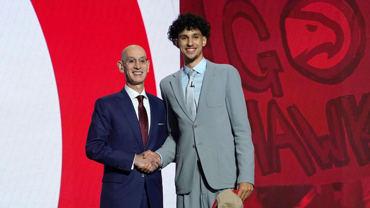 Zaccharie Risacher (R) was taken with the first pick in the 2024 NBA Draft. (Photo by TIMOTHY A. CLARY / AFP)