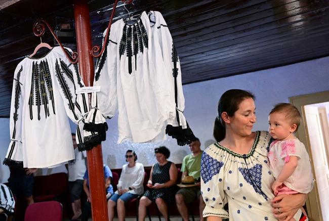 Examples of traditional Romanian blouses at a show in Vaideeni