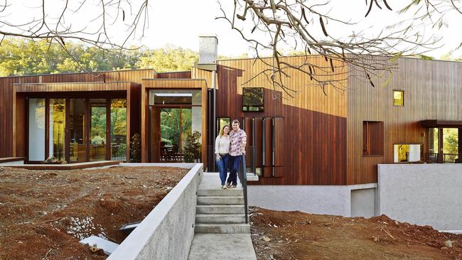 Milly Bradshaw and Andrew Wilson at the house they designed in Brookfield. Photo: Foxtel.