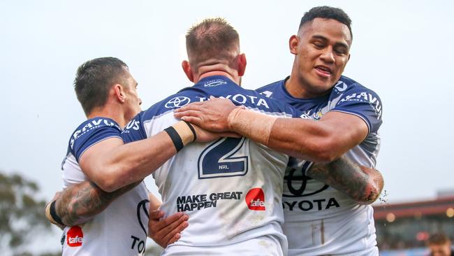 Scott Drinkwater, Kyle Feldt and VIliami Vailea celebrate a North Queensland Cowboys try against Penrith Panthers in Round 17 of the NRL at BlueBet Stadium on June 30, 2024. Picture: NRL Photos