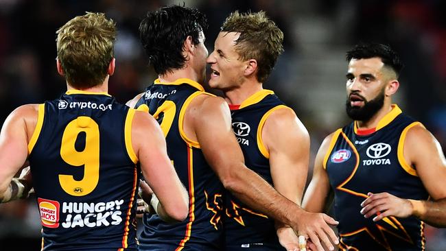 ADELAIDE, AUSTRALIA – APRIL 13: Darcy Fogarty of the Crows celebrates a goal with Jordan Dawson of the Crows during the round five AFL match between Adelaide Crows and Carlton Blues at Adelaide Oval, on April 13, 2023, in Adelaide, Australia. (Photo by Mark Brake/Getty Images)