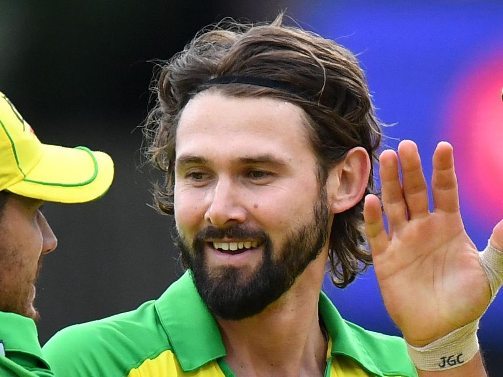 (L/R): Australia's Nathan Coulter-Nile, Australia's Kane Richardson and Australia's Mitchell Starc embrace as they celebrate after victory in the 2019 Cricket World Cup group stage match between Australia and Pakistan at The County Ground in Taunton, southwest England, on June 12, 2019. (Photo by Saeed KHAN / AFP) / RESTRICTED TO EDITORIAL USE