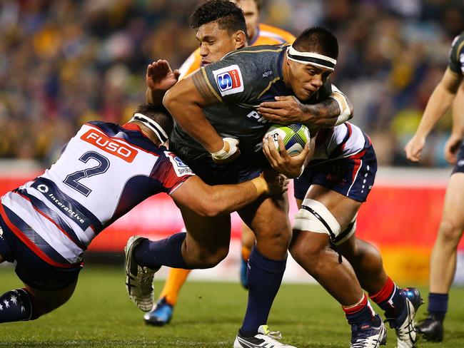 CANBERRA, AUSTRALIA - JUNE 03: Allan Alaalatoa of the Brumbies is tackled during the round 15 Super Rugby match between the Brumbies and the Rebels at GIO Stadium on June 3, 2017 in Canberra, Australia.  (Photo by Mark Nolan/Getty Images)