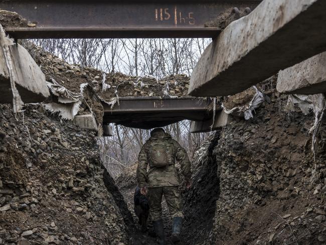 A Ukrainian soldier walks in a trench on the front line in Zolote, Ukraine. A build-up of Russian troops along the border with Ukraine has heightened worries that Russia intends to invade. Picture: Getty Images