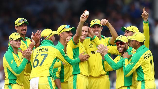 Jason Behrendorff holds up the ball after taking his fifth wicket in Australia’s World Cup victory over England at Lord’s. Picture: Getty Images