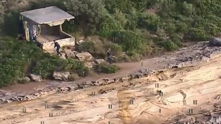 Police at the abandoned World War Two searchlight emplacement at Bluefish Point where Annika Ferry fell and suffered fatal head injuries. Picture: 7News