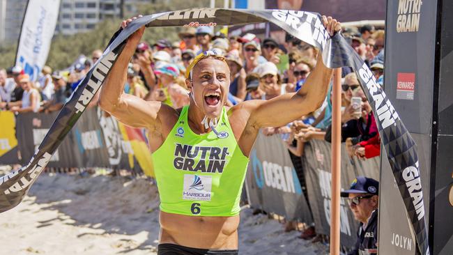 Matt Bevilacqua celebrates as he crosses the finish line to win Round 5 of the Nutri-Grain Ironman Series at Surfers Paradise. Picture: Jerad Williams