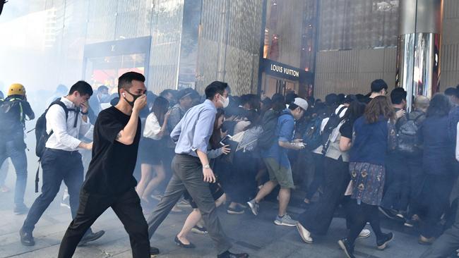 People battle tear gas during another Hong Kong protest. Picture: AFP