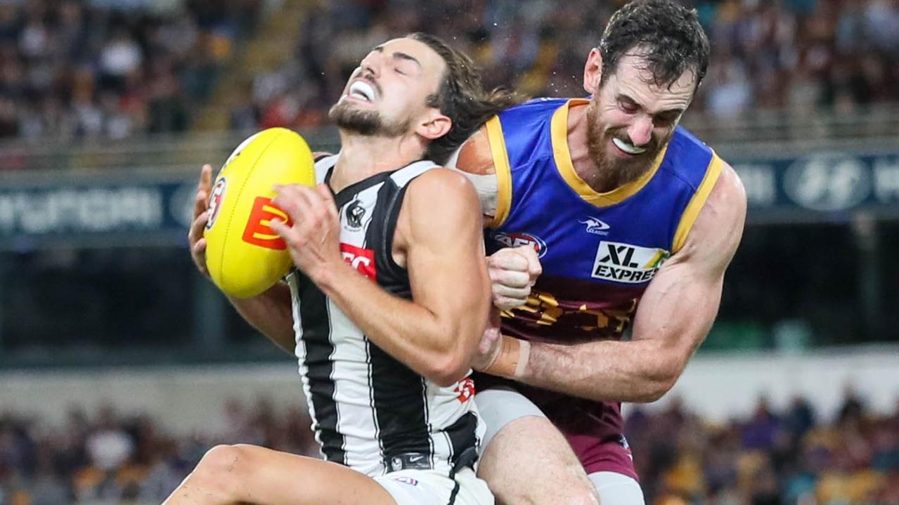 BRISBANE, AUSTRALIA - APRIL 14: Josh Daicos of the Magpies marks the ball during the 2022 AFL Round 05 match between the Brisbane Lions and the Collingwood Magpies at the Gabba on April 14, 2022 In Brisbane, Australia. (Photo by Russell Freeman/AFL Photos via Getty Images)