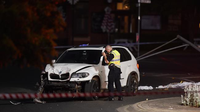 The white BMW was seriously damaged from the impact of the crash, with its bumper nearly torn off. Picture: NCA NewsWire / Josie Hayden