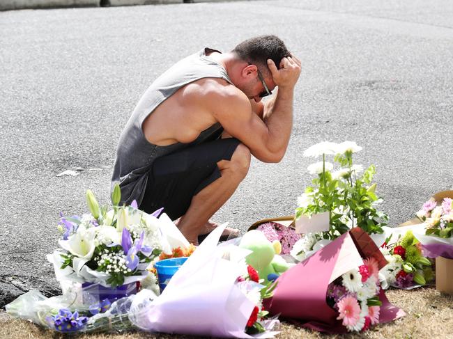 A family friend in tears at the scene of the car fire to while paying respects to Hannah Clarke and her three children. Photographer: Liam Kidston