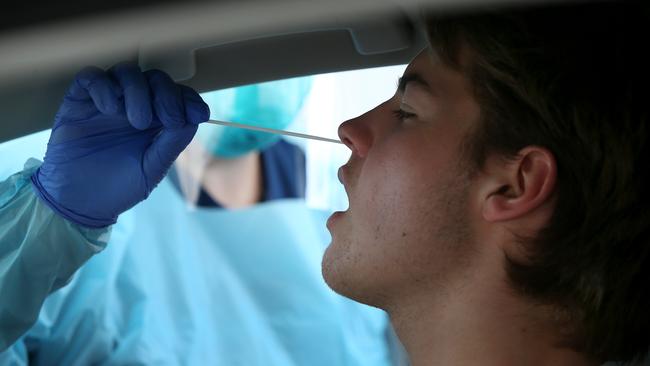 A man receives the unpleasant nasal swab during a COVID test.