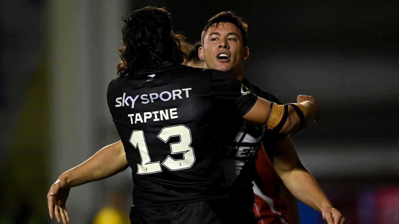 WARRINGTON, ENGLAND - OCTOBER 16: Joseph Manu of New Zealand celebrates with Joseph Tapine after his second half try during Rugby League World Cup 2021 Pool C match between New Zealand and Lebanon at The Halliwell Jones Stadium on October 16, 2022 in Warrington, England. (Photo by Gareth Copley/Getty Images)