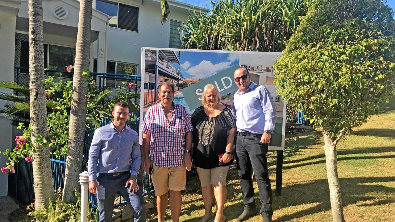 Belle Property Noosa&#39;s Lachlan Bycroft and Ben Radcliff with the sellers at 16 Pacific Heights Ct, Coolum Beach.