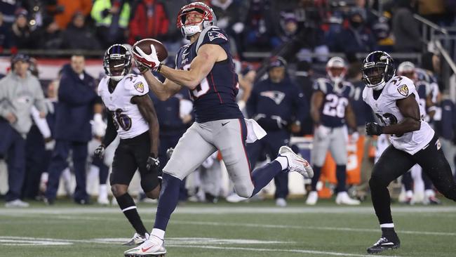 Chris Hogan #15 of the New England Patriots makes a 79-yard touchdown reception during the fourth quarter against the Baltimore Ravens.