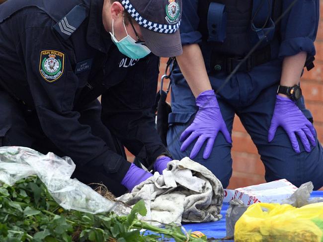 Police search for evidence at a block of flats in the Sydney suburb of Lakemba on July 31, 2017, after counter-terrorism raids across the city in connection to the bomb plot. Picture: AFP