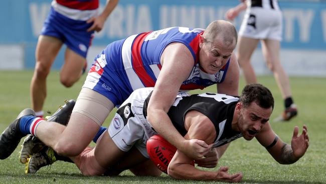 Point Cook’s Kirk Hebele competes with Parkside’s Joshua Shaw. Picture: Mark Dadswell