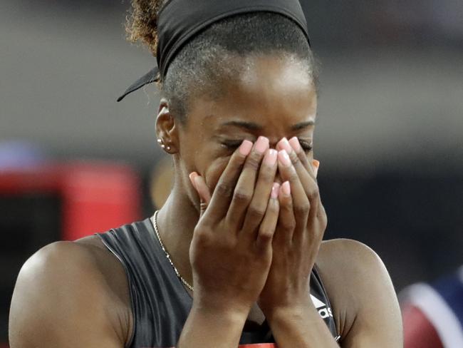 Kendra Harrison of the US reacts after wining the women's 100 meter hurdles in a world record time of 12.20 seconds during the Diamond League anniversary games at The Stadium, in the Queen Elizabeth Olympic Park in London, Friday, July 22, 2016. (AP Photo/Matt Dunham)