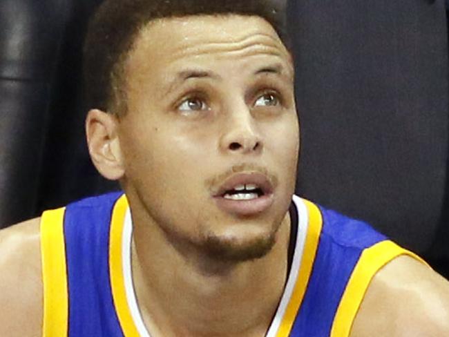 FILE - In this Sunday, May 22, 2016, file photo, Golden State Warriors guard Stephen Curry pauses on the bench during the first half in Game 3 of the NBA basketball Western Conference finals against the Oklahoma City Thunder in Oklahoma City. Despite finishing the regular season with a record-breaking 73 wins, the Golden State Warriors find themselves one game away from being prematurely eliminated in the NBA Playoffs. Down 3-1, the defending NBA champions will have to win three-straight games to advance. (AP Photo/Sue Ogrocki, File)