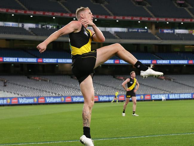 AFL Round 1. Richmond vs Carlton at the MCG..  20/03/2020.  Josh Caddy of the Tigers kicks infant of empty stands   . Pic: Michael Klein