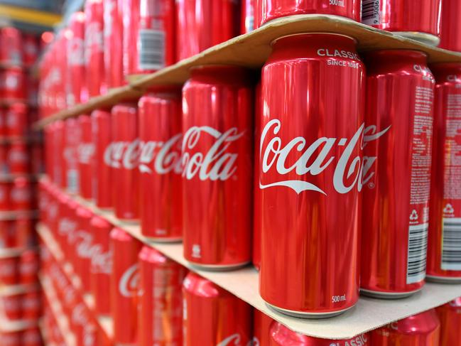 Cans of coke are seen at the Coca Cola factory in Melbourne, Tuesday, February 25, 2020. Andrews has announced a $96.5mil package to improve Victoria's recycling industry. (AAP Image/James Ross) NO ARCHIVING