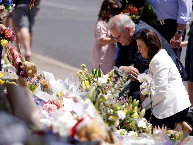 Prime Minister Scott Morrison and his wife Jenny lay flowers. Picture: NCA NewsWire / Grant Viney