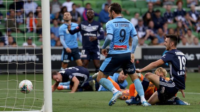 Sydney striker Adam Le Fondre scores his side’s opening goal against Melbourne Victory at AAMI Park. Picture: Getty Images