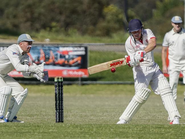 Langwarrin keeper Taylor Smith and Baden Powell batter Travis Kellerman. Picture: Valeriu Campan