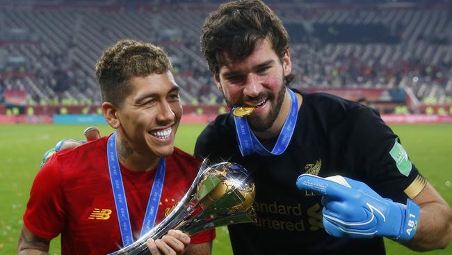 Roberto Firmino and Alisson Becker celebrate Liverpool’s victory. Picture: Getty Images