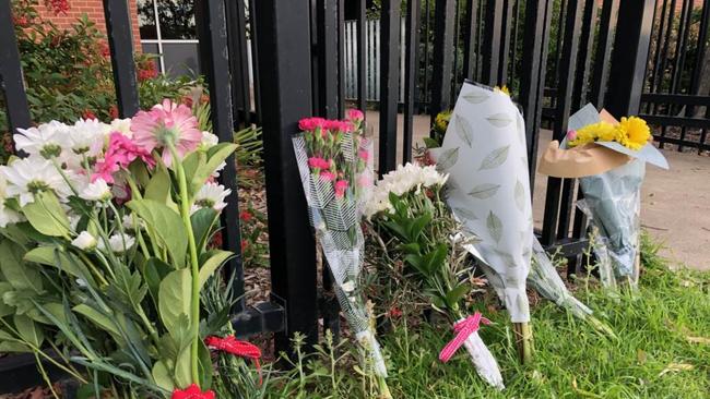 Floral tributes have been left at the front of Ulladulla High School after Zoie Bell was hit by a bus and died on July 1. Picture: Sam Strong