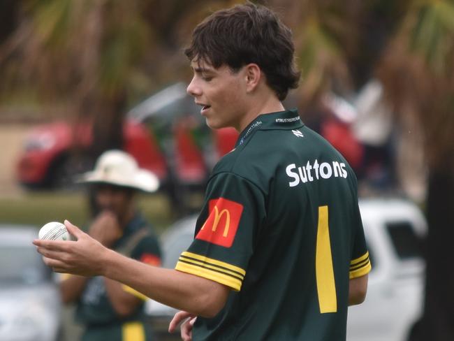 Randwick-Petersham bowler Harrison Salmon inspects the ball during his spell of 2-28. Picture: Sean Teuma.