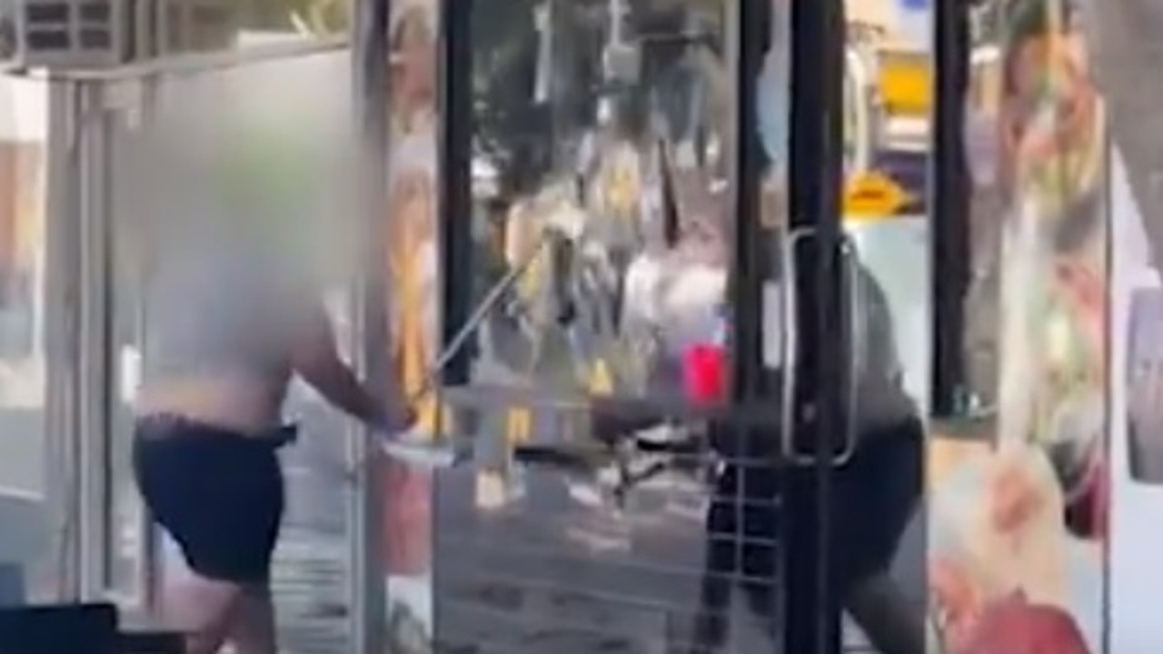 A man smashed through a shop’s front window with a table. Picture: Herald Sun