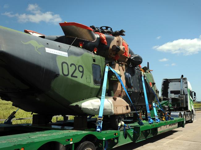 MHR-90 Taipan helicopter crosses the Burdekin Bridge on the back of a truck. Picture: Bryan Lynch