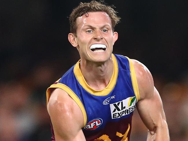 BRISBANE, AUSTRALIA - MAY 09: Ryan Lester of the Lions handballs during the round eight AFL match between the Fremantle Dockers and the Brisbane Lions at The Gabba on May 09, 2021 in Brisbane, Australia. (Photo by Chris Hyde/Getty Images)