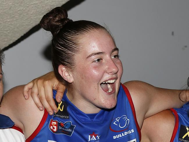 Central District women's players (from left) Katelyn Rosenzweig,Courtney Jensen and Jayme-Lee Sonneman sing the team song after defeatingWoodville-West Torrens in SANFLW on Friday, March 1 2019. Credit: DebCurtis.